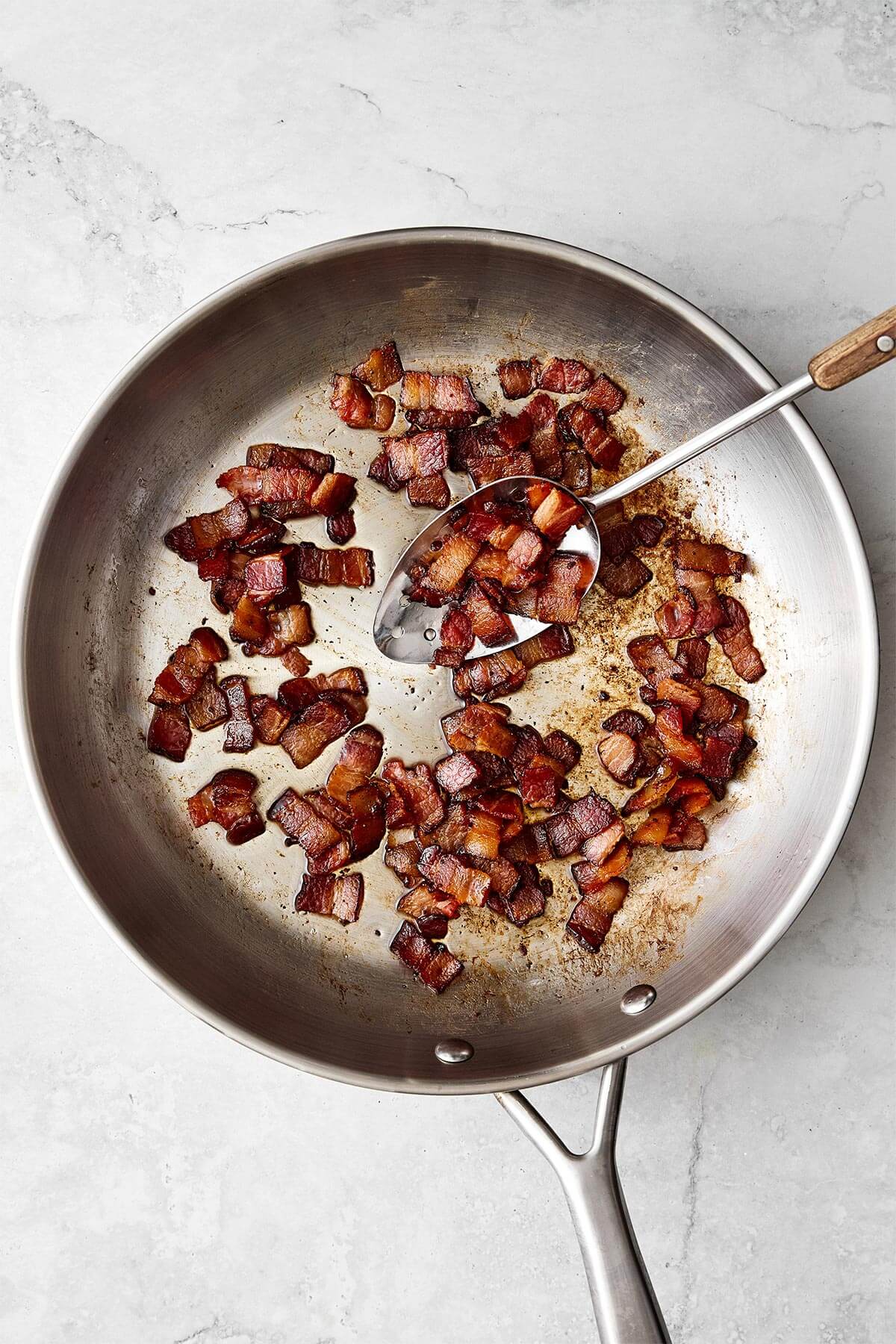Cooking bacon in a pan.