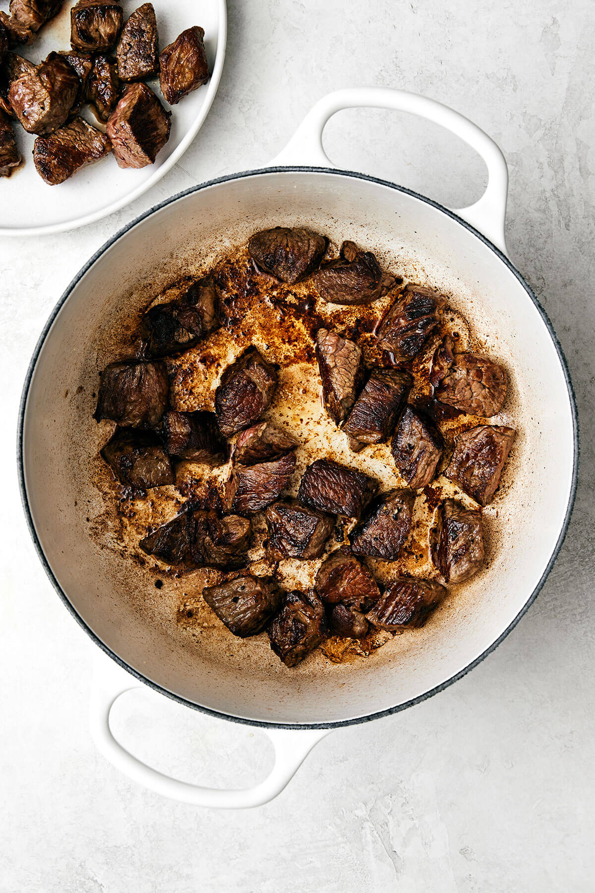 Searing beef stew meat in a pot