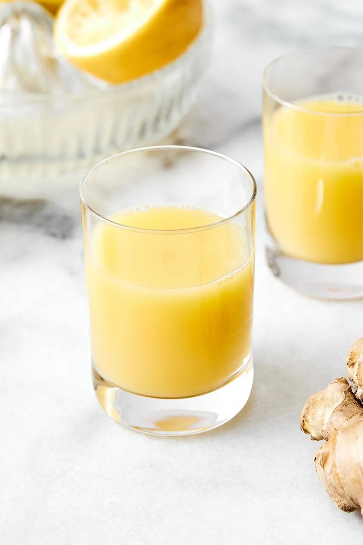 Glasses of ginger shots.