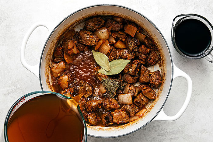 Cooking beef stew in a pot