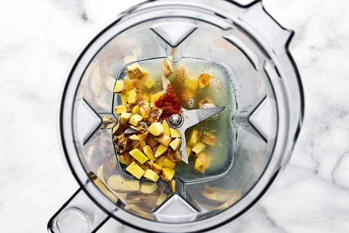 A blender with ginger shot ingredients.
