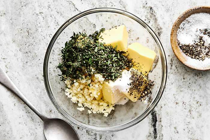 A bowl of garlic herb butter.