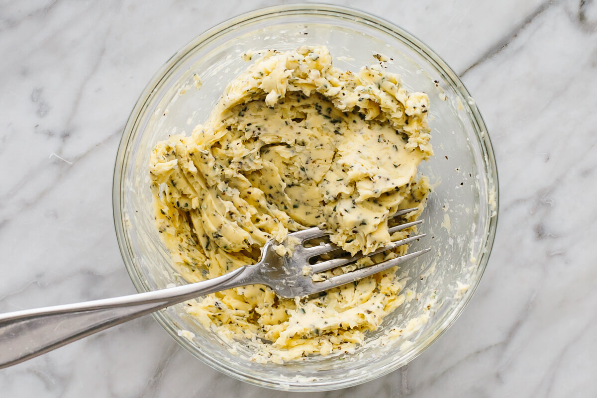 Garlic herb butter mixed in a bowl.