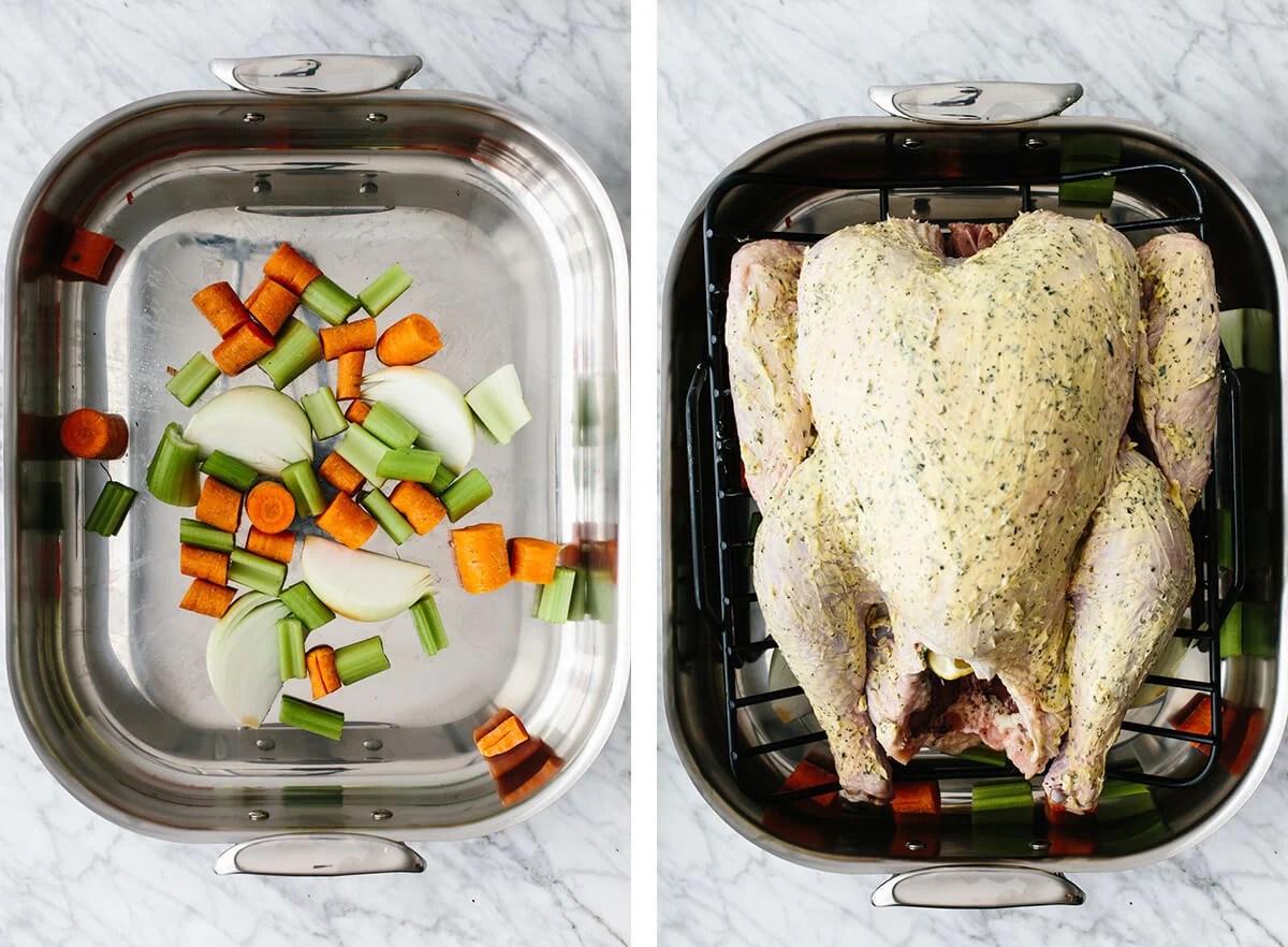 Thanksgiving turkey on a roasting rack above vegetables.