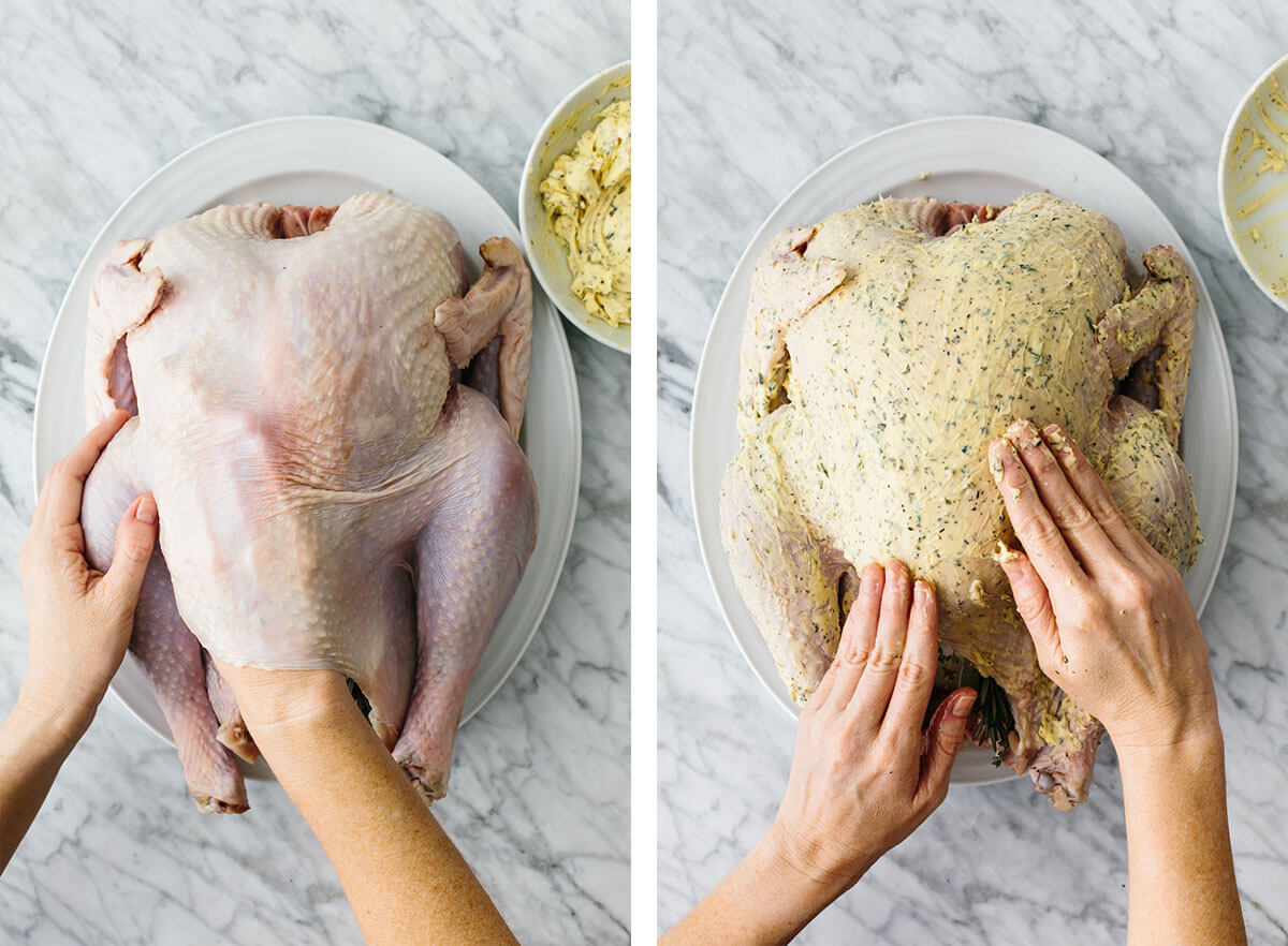 Spreading herb butter all over Thanksgiving turkey